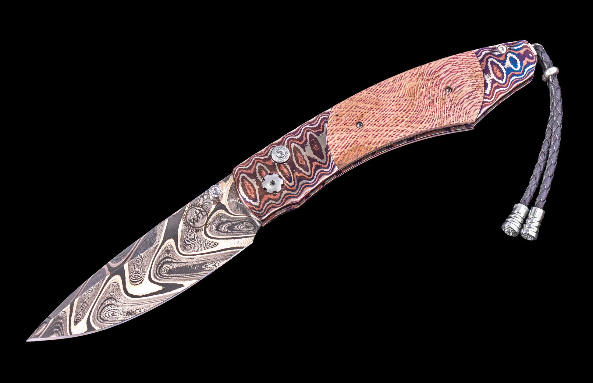 Decorative knife with a patterned blade and handle on a black background