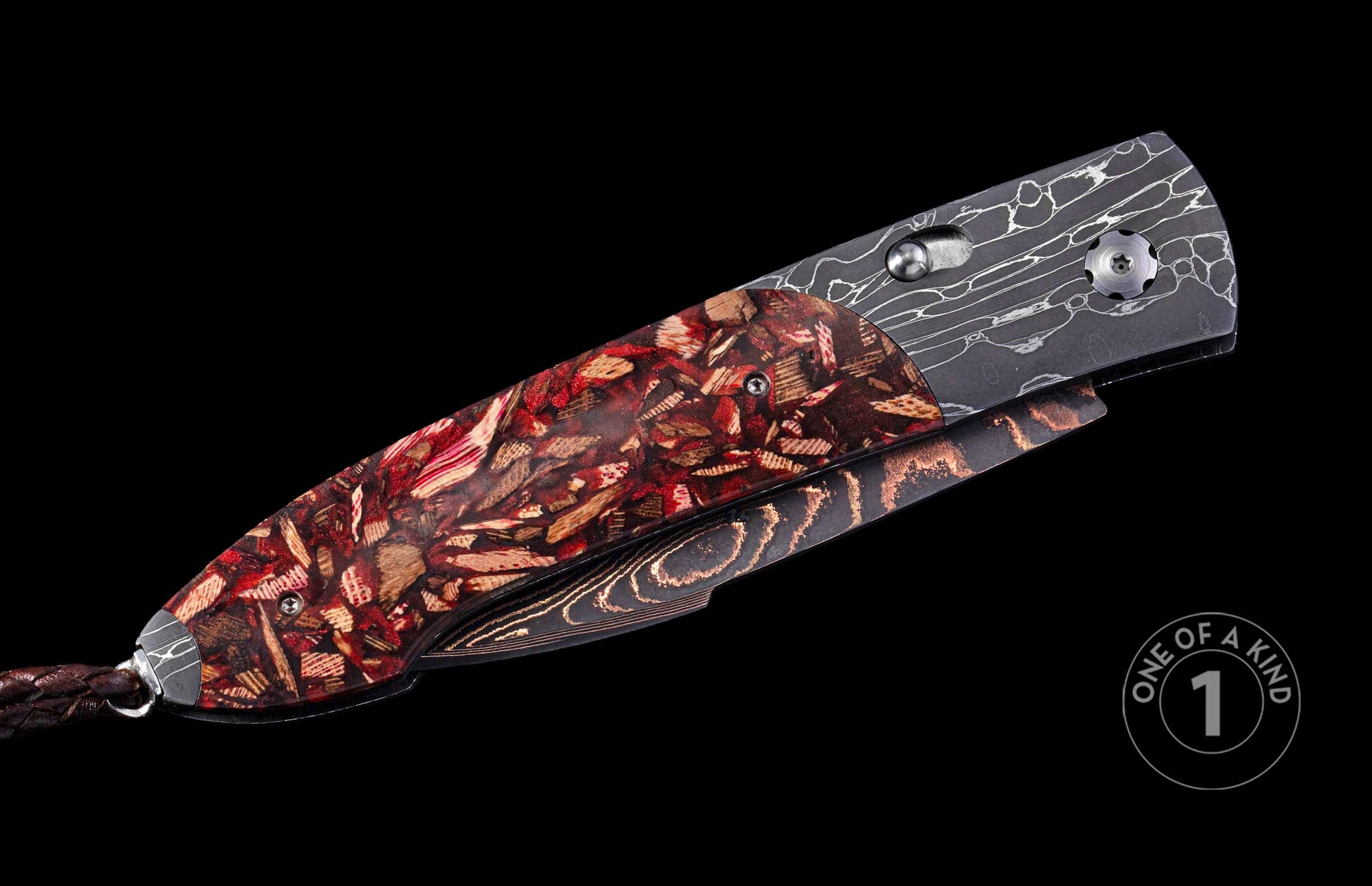 Automatic folding knife with a red and brown wood-resin handle, dark Damascus steel, copper-accented frame, and braided leather lanyard.