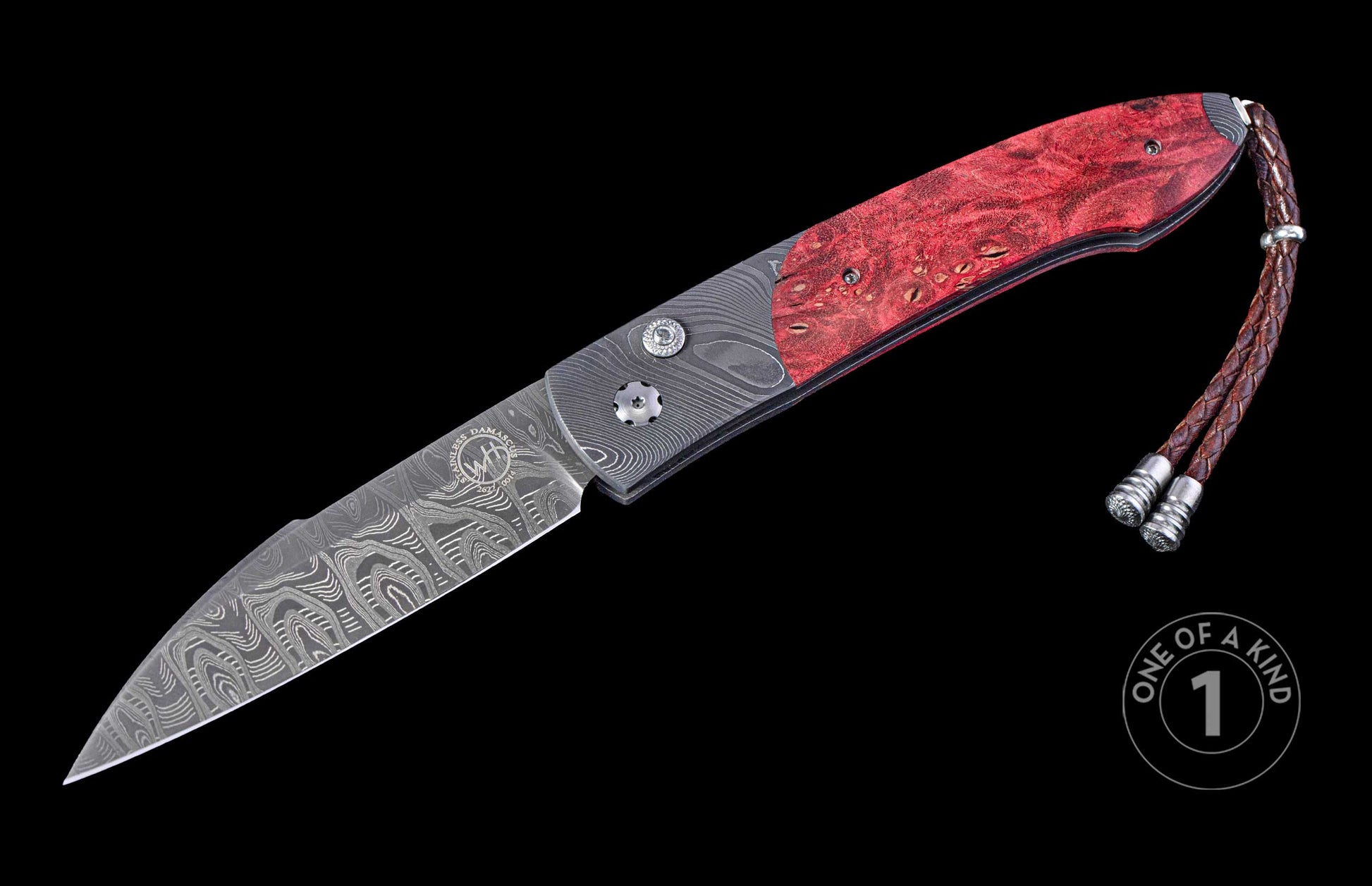 Open folding knife with red  wood handle and damascus blade on a black background