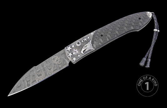 open knife with star and eagle engraved handle on a black background, featuring 'One of a Kind' branding.