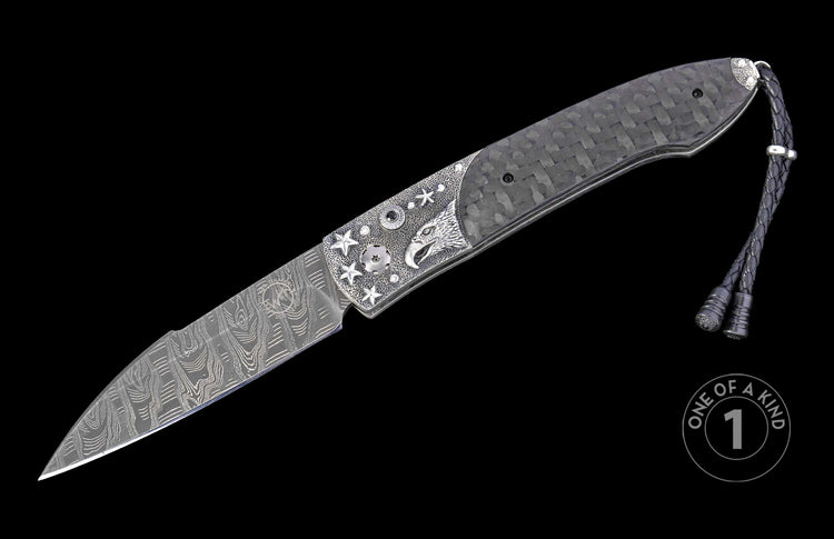 Automatic folding knife with a patterned Damascus blade, silver-toned eagle head and star-embellished handle, carbon fiber scales, and braided leather lanyard.