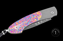 Folding knife with vibrant mokume-gane handle and damascus blade, by custom artisan, side view, one of a kind