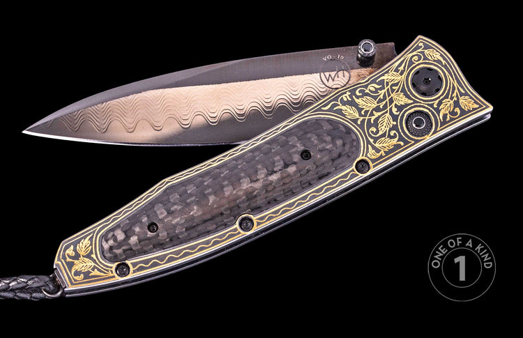 Damascus steel folding knife with black carbon fiber handle, gold floral inlay, and braided lanyard, one of a kind, side view