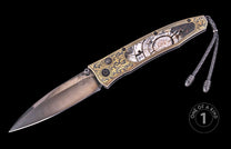 Damascus steel folding knife with mother-of-pearl inlay and gold filigree, by W.T. (one of a kind), side view on black background