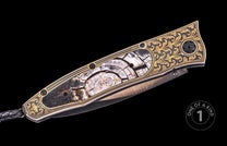Luxury folding knife with black and gold floral engraving, fossilized wood inlay, and textured blade, side view, one of a kind