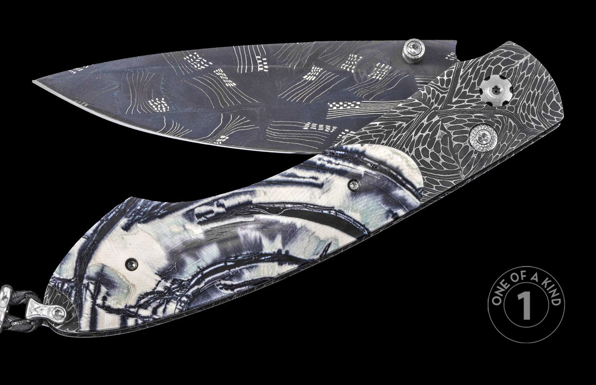 Luxury folding knife with damascus steel blade and agate inlay handle, featuring intricate etched patterns and silver hardware, one-of-a-kind design, side view