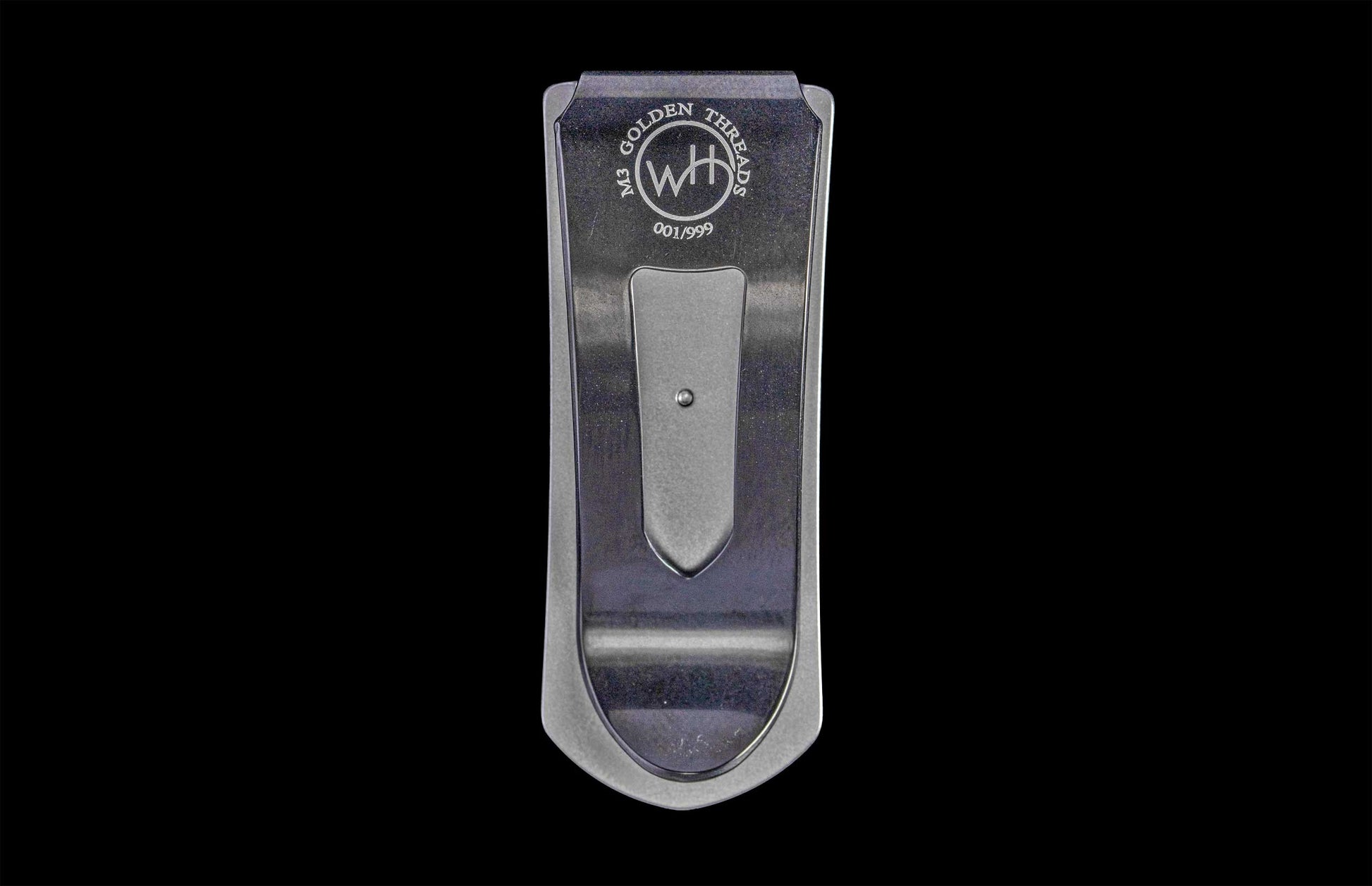 William Henry money clip on back background