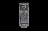 Metal money clip with a brand logo on a black background