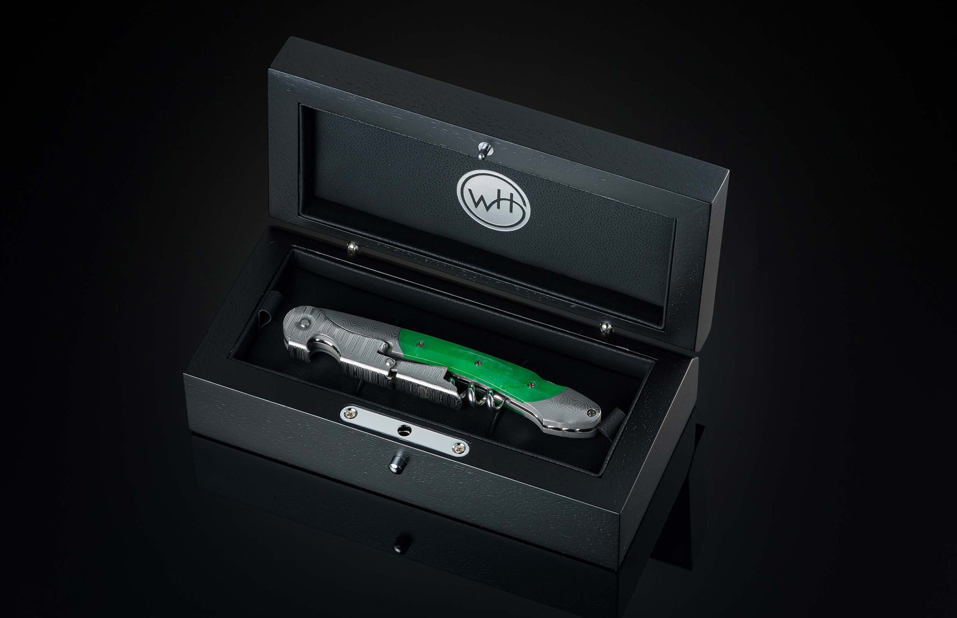 Sommelier Wine Opener with Jade handle in a black box with a visible brand logo on a dark background