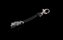 William Henry key fob features a sterling silver snake head and a round-braided black leather cord