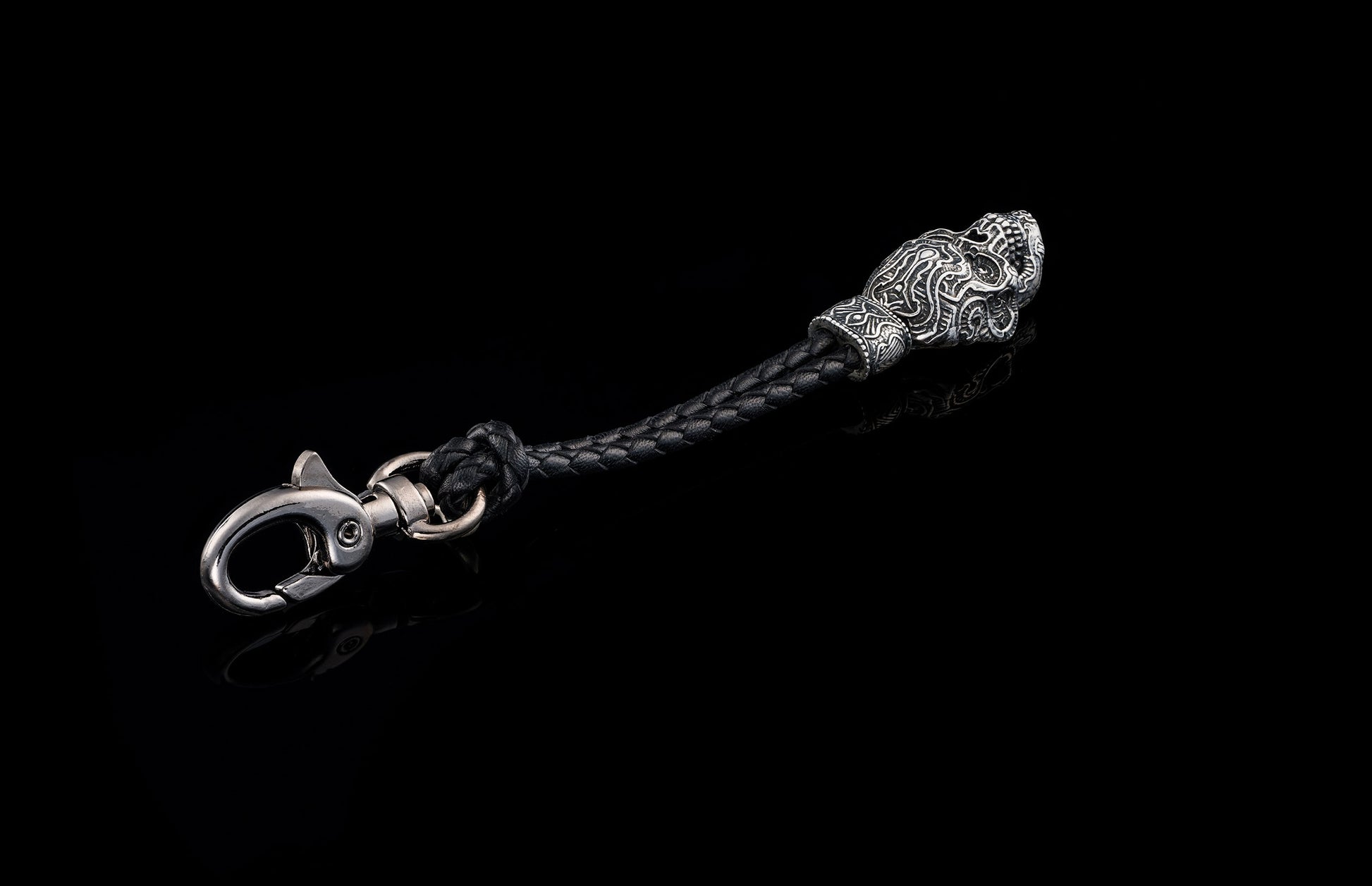 Black braided leather and ornate silver-toned key chain by Touchstone, featuring a stylized animal head and lobster clasp.