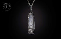 Dark patterned folding knife pendant featuring a gray stone inlay and crystal accents, suspended from a silver chain.