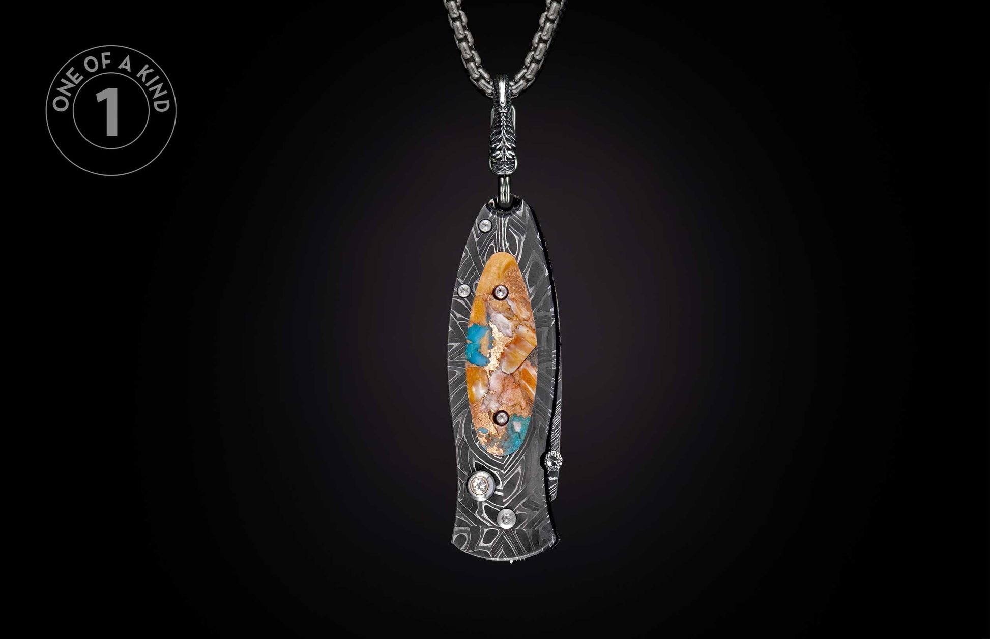 Damascus steel knife with an oval inlay of orange, white, and blue stones with gold flakes, hanging from a silver chain.