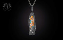 Damascus steel knife with an oval inlay of orange, white, and blue stones with gold flakes, hanging from a silver chain.