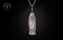 Ornate silver-toned knife featuring iridescent mother-of-pearl inlay, Celtic knot patterns, and gemstones, suspended from a chain.