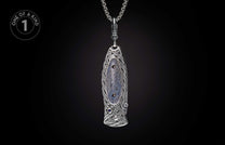 Ornate silver knife with intricate Celtic patterns, a grey-blue stone inlay, and sapphire accents, suspended by a chain.