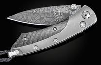 The folding titanium pocket knife with carbon fiber and Damascus steel