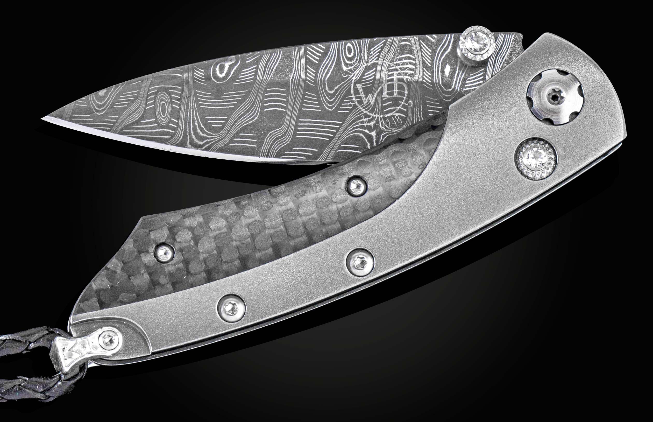 The folding titanium pocket knife with carbon fiber and Damascus steel