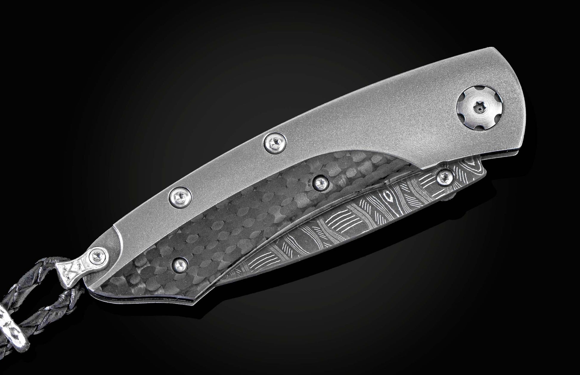 The folding titanium pocket knife with carbon fiber and Damascus steel
