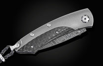 The folding titanium pocket knife with carbon fiber and Damascus steel
