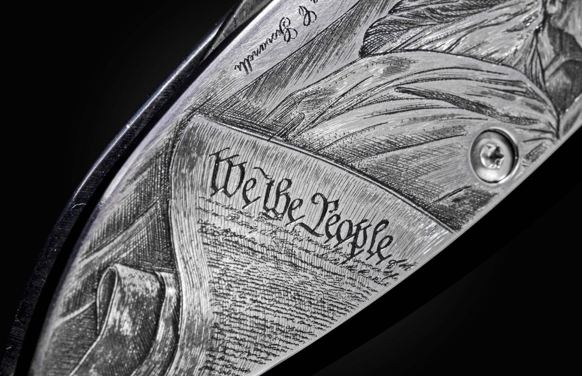 Handcrafted pocket knife from William Henry featuring a stainless steel frame hand-engraved with images of the Statue of Liberty and set with blue sapphires. The blade is hand-forged damascus steel.
