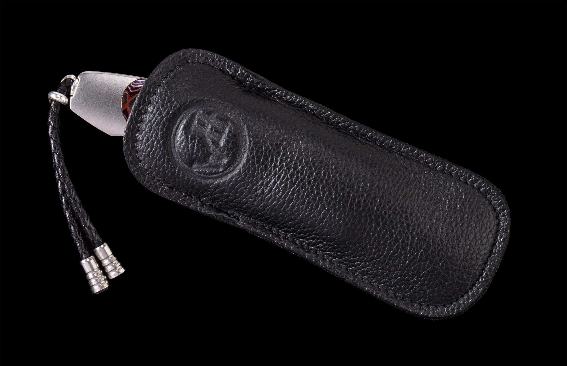 The Dark Fire Titanium Pocketknife with 'Wave' Mokume and Damascus Blade in a leather case