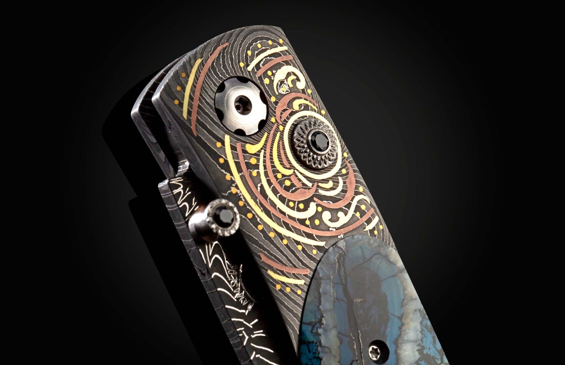 Handcrafted pocket knife from William Henry features a hand-forged Damascus frame with fine inlays of 24K & 22K yellow gold