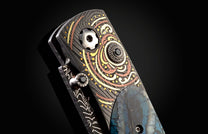 Handcrafted pocket knife from William Henry features a hand-forged Damascus frame with fine inlays of 24K & 22K yellow gold