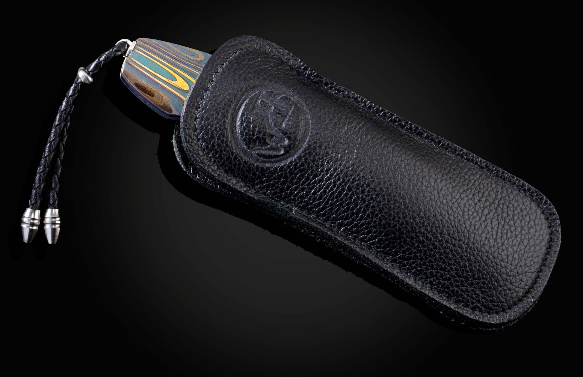 Handcrafted pocket knife from William Henry features a frame in laser engraved and anodized titanium