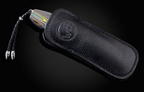 Handcrafted pocket knife from William Henry features a frame in laser engraved and anodized titanium