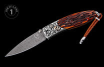 Ornate folding knife with a Damascus blade, silver skull-decorated bolster featuring a gold skull, textured brown handle, and braided leather lanyard.