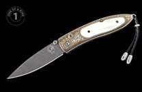 Ornate folding knife with a Damascus blade and white handle inlay, featuring gold-toned engraved bolsters and a black leather lanyard.