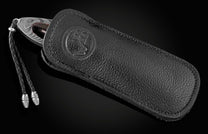 Handcrafted pocket knife from William Henry features a frame in hand-forged Damascus steel
