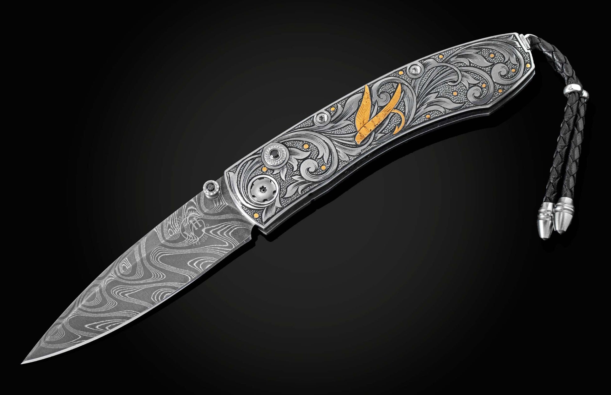 Hand forged Damascus steel blade pocket knife from William Henry. The knife is hand-engraved handle with 24K gold inlays depicting a floral design and a fly fishing lure. The knife is displayed fully open on a black background.