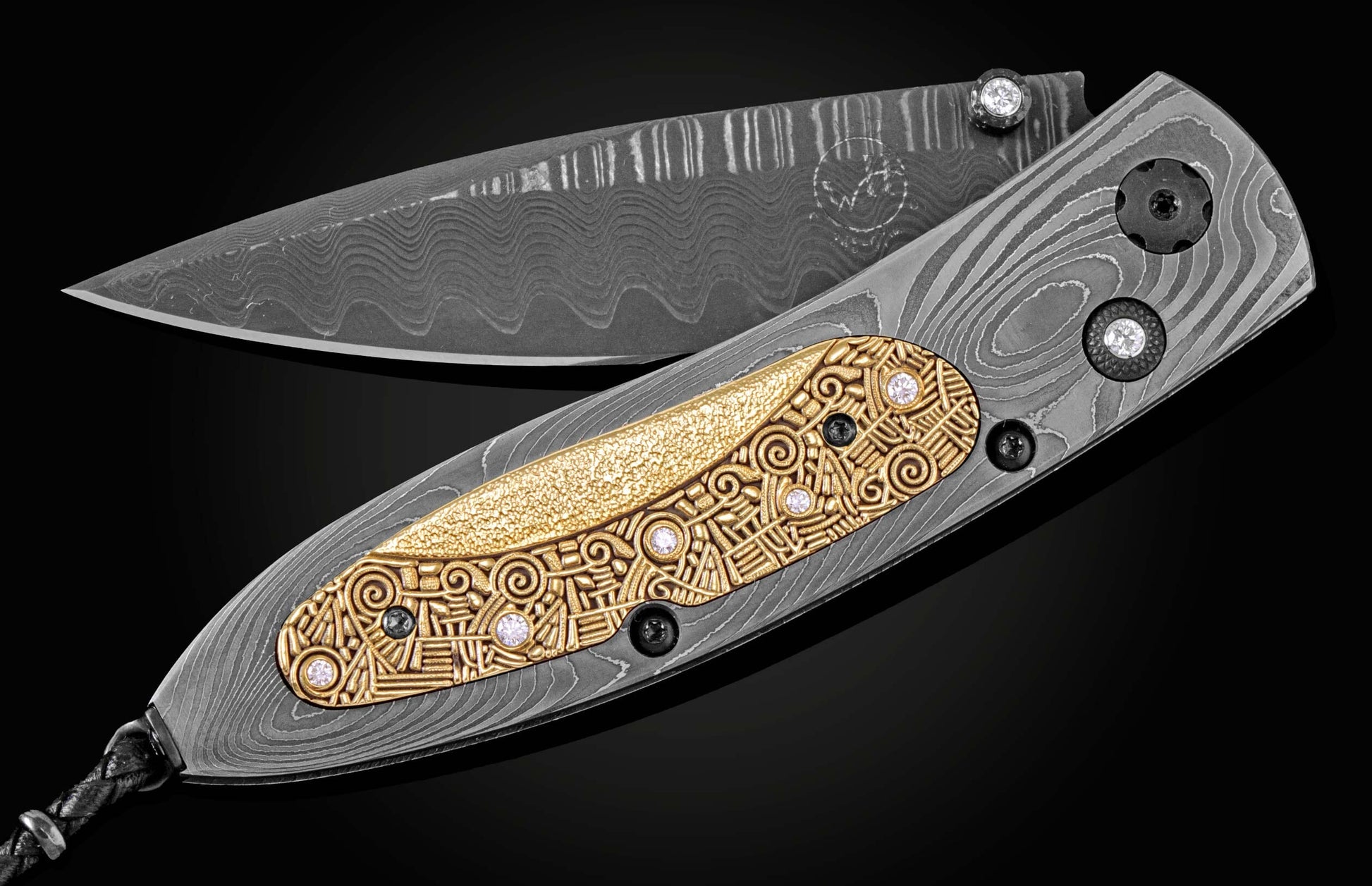 Handmade pocket knife from William Henry features a frame in hand-forged Damascus inlaid with 18K gold scales embedded with white diamonds by Alex Sepkus. The blade is hand forged Damascus steel.