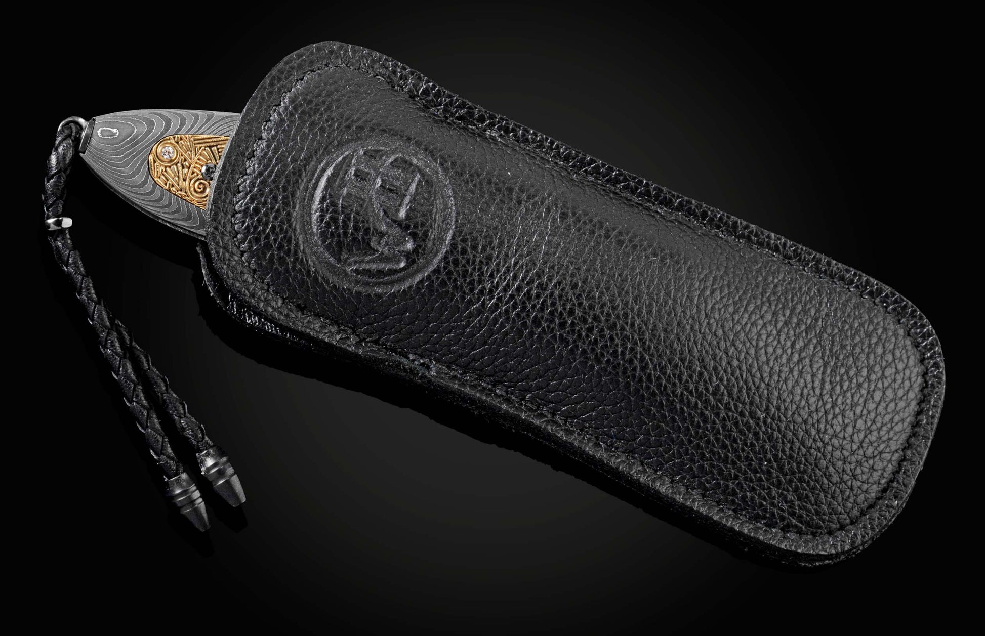 Handmade pocket knife from William Henry features a frame in hand-forged Damascus inlaid with 18K gold scales embedded with white diamonds by Alex Sepkus. The blade is hand forged Damascus steel.