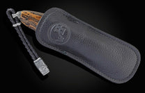 Handcrafted William Henry knife with a hand-carved sterling silver frame depicting an eagle head by Lee Downey