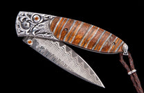 The Silver Eagle mammoth tooth pocket knife with citrine handle and Damascus blade