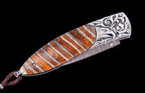 The Silver Eagle mammoth tooth pocket knife with citrine handle and Damascus blade
