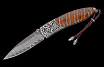 The Silver Eagle mammoth tooth pocket knife with citrine handle and Damascus blade
