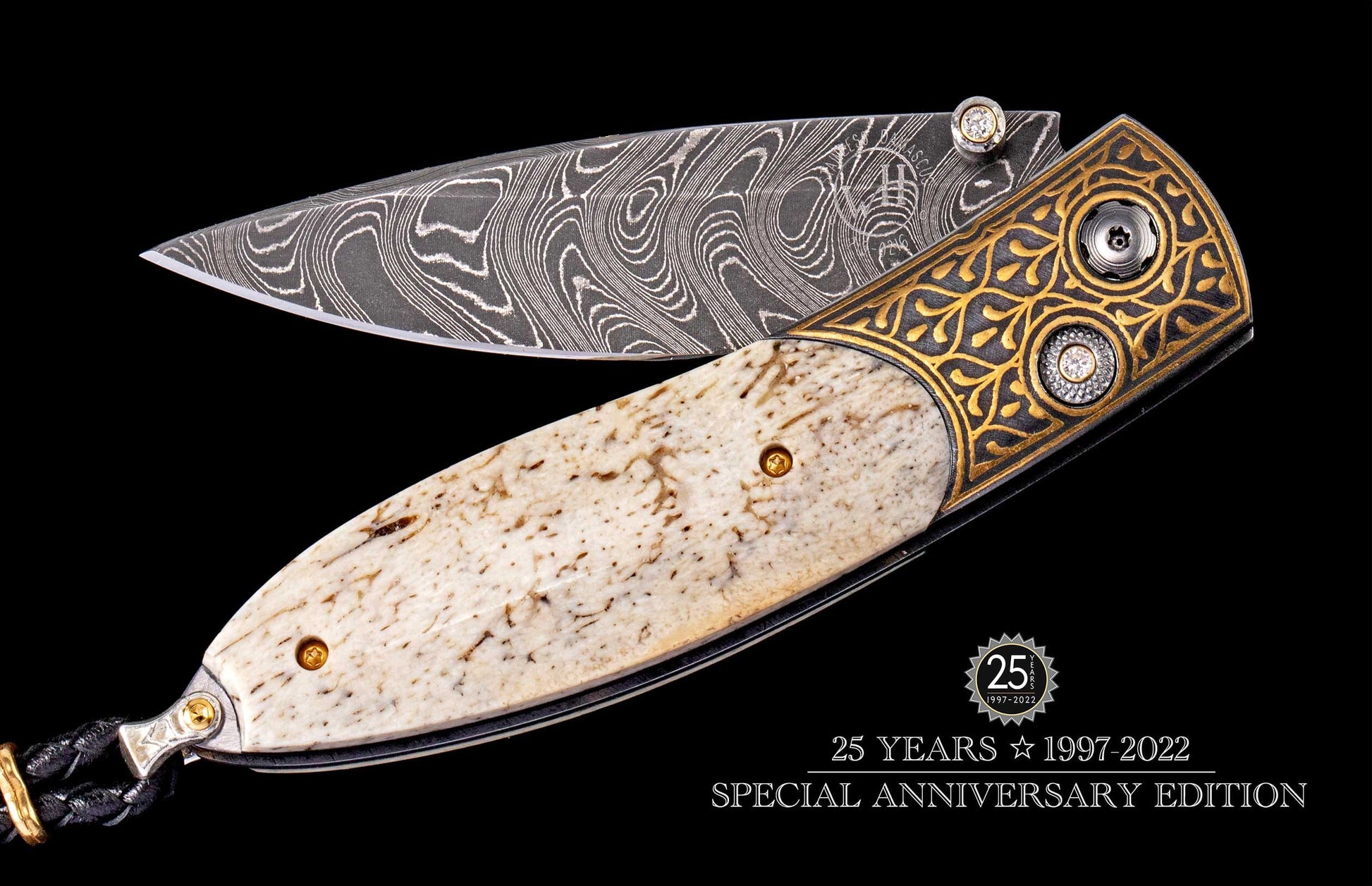 Damascus steel blade knife with an antler handle, ornate gold and dark engraved bolster, and diamond accents, marking a 25-year anniversary.