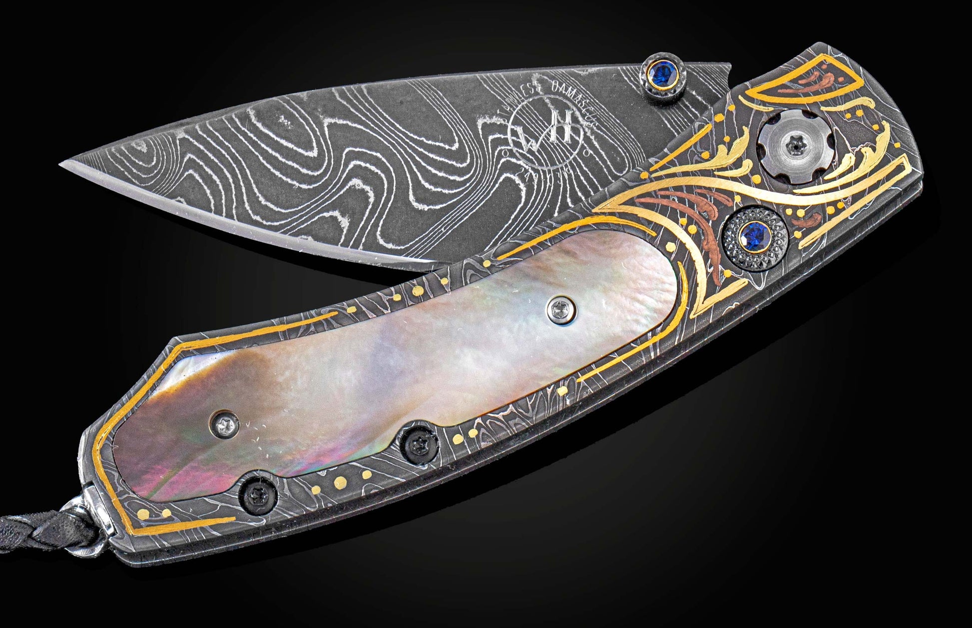 Handcrafted William Henry knife with hand-forged damascus steel frame and blade by Chad Nichols, inlayed with of 24K & 22K gold, 18K green gold and copper by Tyler Prince, then set with sapphires and black lip pearl. 