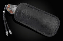 Handcrafted pocket knife from William Henry with hand-engraved and carved handles depicting an eagle with 24K gold