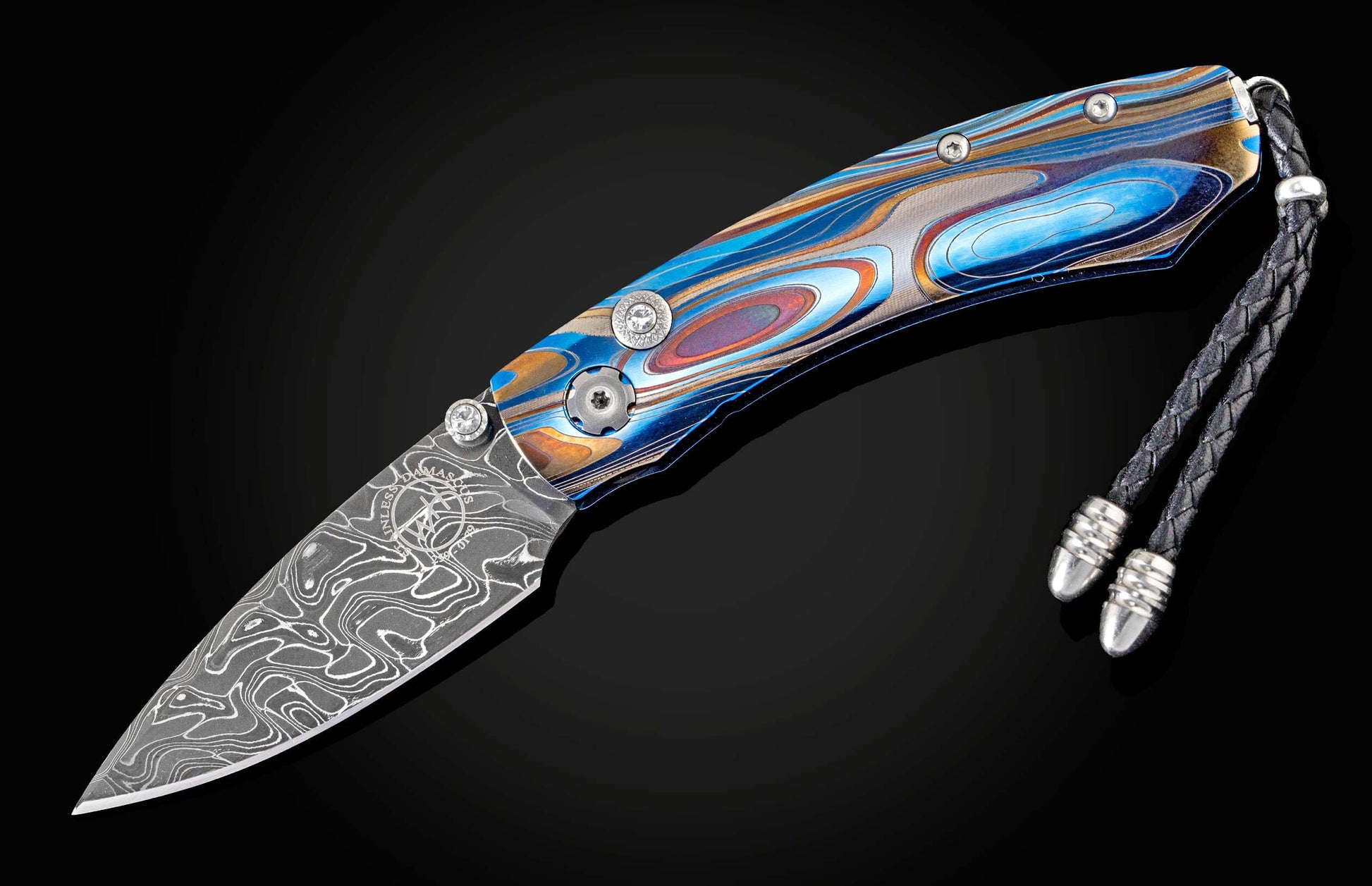  and a hand-forged Damascus steel blade by Chad Nichols