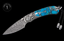 Ornate folding knife with a Damascus blade, vibrant turquoise stone handle, intricate silver detailing, and black lanyard.