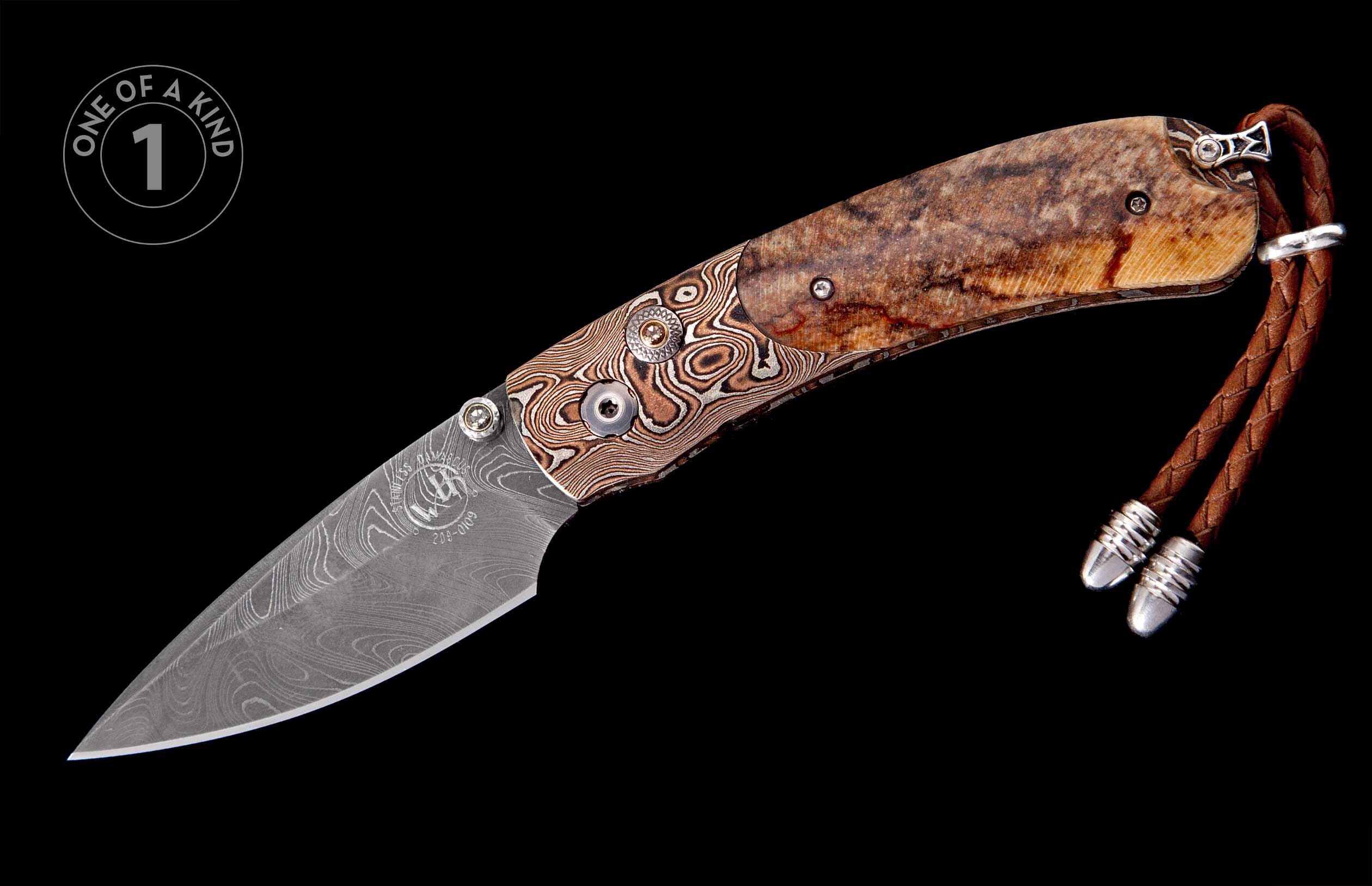 Custom folding knife featuring a Damascus steel blade and bolster, a unique natural bone handle, and braided leather lanyard.
