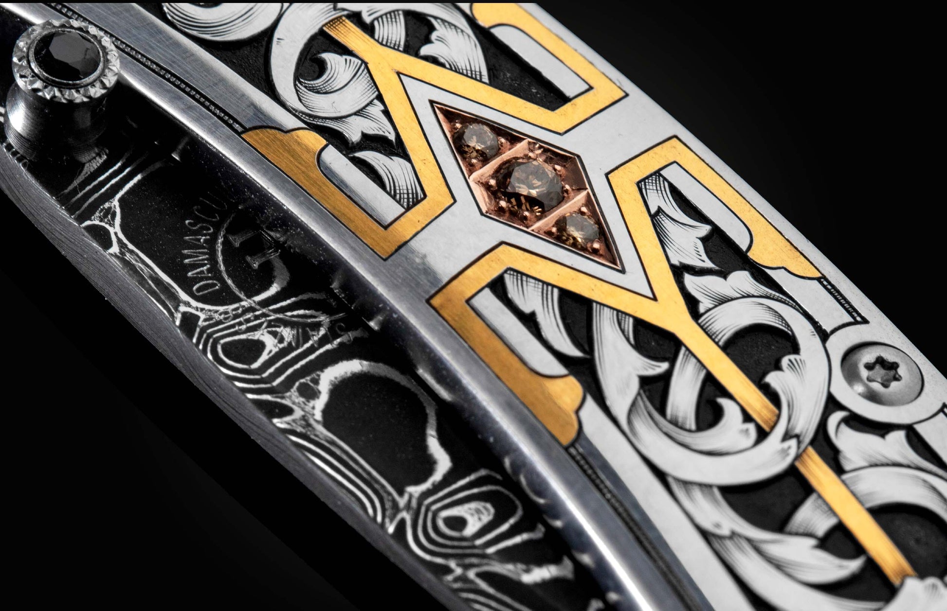  and a hand-forged damascus steel blade by Chad Nichols