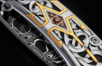  and a hand-forged damascus steel blade by Chad Nichols
