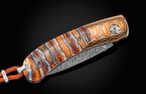 Handcrafted William Henry knife with Wave Mokume frame inlaid with fossil Woolly Mammoth tooth
