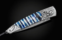  and a hand forged Damascus steel blade.